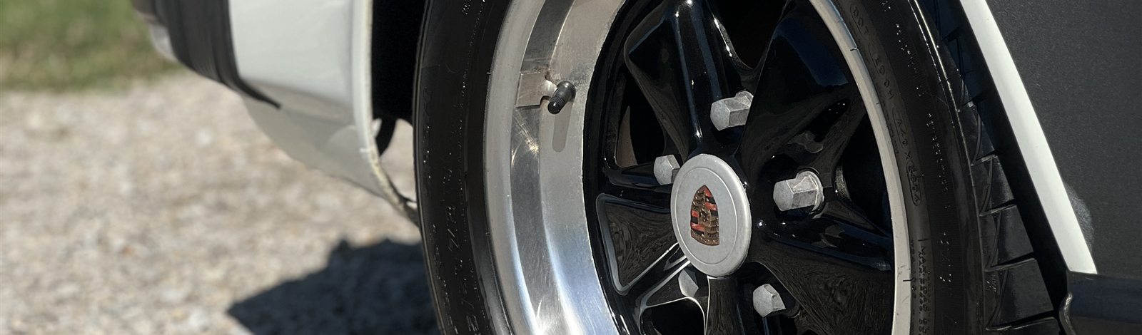 Porsche 911 rear wheel and fender after detailing