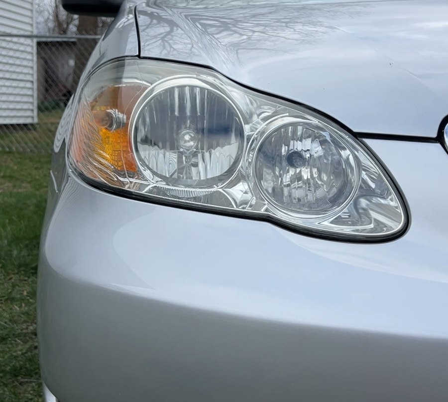 Headlight lens before restoration, yellowed and cloudy