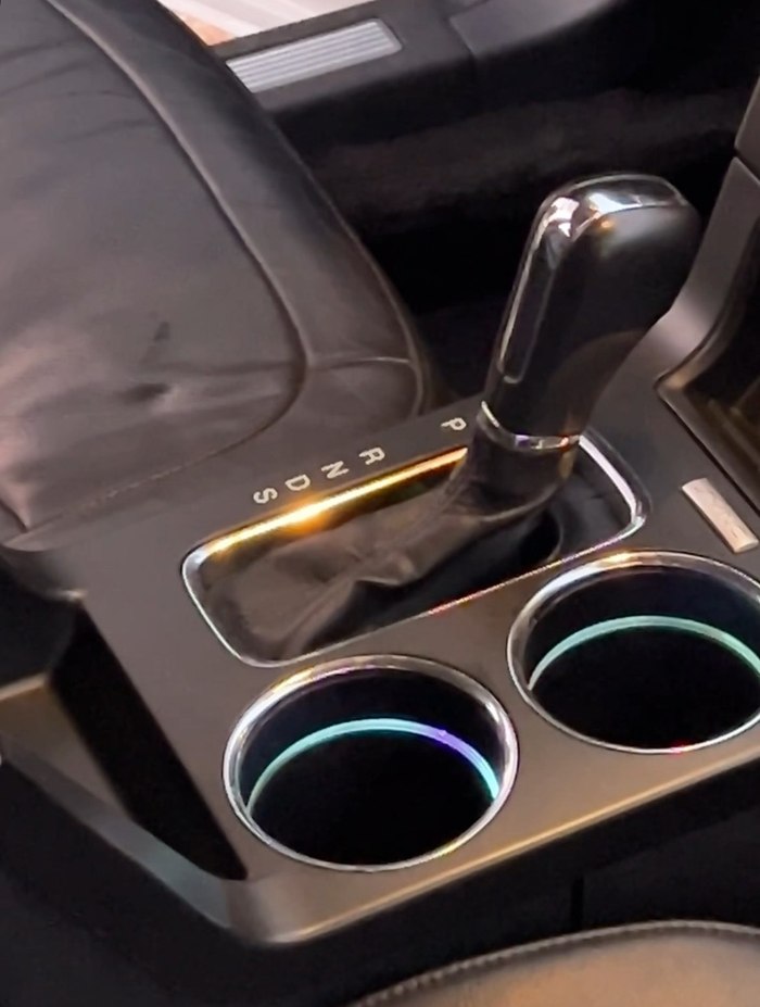 Center console before interior detailing, with grime built into the seams