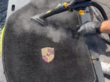 Steam cleaning an interior surface